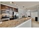 Kitchen with granite countertops, stainless steel appliances, open layout, and access to dining area at 3757 Conroy Rd # 2525, Orlando, FL 32839