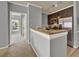 Kitchen with breakfast bar, stainless appliances, granite counters, and easy access to dining area at 3757 Conroy Rd # 2525, Orlando, FL 32839