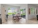 Bright breakfast nook with a view of the backyard through sliding glass doors at 3817 Heartleaf Ln, Mount Dora, FL 32757