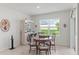 Charming dining area with backyard views, a stylish bar, and comfortable seating for meals at 3817 Heartleaf Ln, Mount Dora, FL 32757
