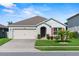 Charming single-story home featuring a well-kept lawn and a convenient two-car garage at 3817 Heartleaf Ln, Mount Dora, FL 32757