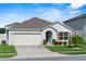 Charming single Gathering home with a well-manicured lawn and a two-car garage at 3817 Heartleaf Ln, Mount Dora, FL 32757