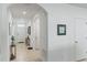 Bright foyer with tile floors, an arched entry, and white walls, offering a welcoming entrance at 3817 Heartleaf Ln, Mount Dora, FL 32757