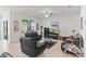 Comfortable living room featuring tile floors, neutral walls, and comfortable seating arrangement at 3817 Heartleaf Ln, Mount Dora, FL 32757