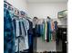 Organized walk-in closet with ample hanging space and storage solutions for clothing and accessories at 3817 Heartleaf Ln, Mount Dora, FL 32757