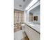 Bright bathroom featuring a granite countertop, skylight, and a palm tree shower curtain at 4438 Pinebark Ave # 4, Orlando, FL 32811