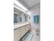 Bright bathroom featuring granite countertop, white brick wall, and blue accents at 4438 Pinebark Ave # 4, Orlando, FL 32811