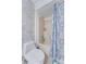 Bright bathroom featuring white brick wall, and patterned shower curtain at 4438 Pinebark Ave # 4, Orlando, FL 32811
