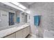 Bright bathroom featuring granite countertop, white brick wall, and blue accents at 4438 Pinebark Ave # 4, Orlando, FL 32811