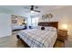 Primary bedroom with wood floors, ceiling fan, and sliding closet doors at 4438 Pinebark Ave # 4, Orlando, FL 32811