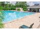Beautiful community pool with lounge chairs, perfect for relaxing and enjoying the Florida sunshine at 4438 Pinebark Ave # 4, Orlando, FL 32811