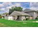 A bright and well-maintained home with a lush green lawn, crisp white fencing, and a cozy, welcoming exterior at 4438 Pinebark Ave # 4, Orlando, FL 32811