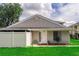 Charming single-story home featuring a lovely front door, complemented by a well-manicured lawn and a cozy, inviting entrance at 4438 Pinebark Ave # 4, Orlando, FL 32811