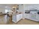 Open kitchen features a center island, granite countertops, and a white oven at 4438 Pinebark Ave # 4, Orlando, FL 32811