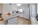 Well-maintained white kitchen features granite countertops and stainless steel appliances at 4438 Pinebark Ave # 4, Orlando, FL 32811