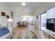 Spacious living room opens to the dining area and offers access to the screened patio at 4438 Pinebark Ave # 4, Orlando, FL 32811