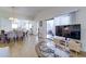 Light-filled living room showcases an open floor plan and access to a screened-in lanai at 4438 Pinebark Ave # 4, Orlando, FL 32811
