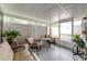 Enclosed patio with neutral colored outdoor seating and white privacy fence at 4438 Pinebark Ave # 4, Orlando, FL 32811