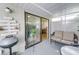 Covered patio features a grill, exterior wall art, and a view into the home at 4438 Pinebark Ave # 4, Orlando, FL 32811