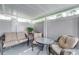 Enclosed patio with tan colored outdoor seating and white privacy fence at 4438 Pinebark Ave # 4, Orlando, FL 32811