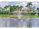 Picturesque pond with a fountain, adding to the tranquil ambiance of the property at 4438 Pinebark Ave # 4, Orlando, FL 32811