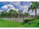 Community tennis court surrounded by lush green landscaping, promising a healthy lifestyle at 4438 Pinebark Ave # 4, Orlando, FL 32811