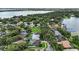 Aerial view showcasing the property within a community featuring mature trees, nearby lake access, and well-maintained homes at 4825 Waterwitch Point Dr, Orlando, FL 32806