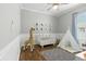 Playful Bedroom with neutral color scheme, featuring hardwood floors, tent and crib at 4825 Waterwitch Point Dr, Orlando, FL 32806