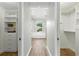 Hallway between and closets leading to the bathroom with soaking tub at 4825 Waterwitch Point Dr, Orlando, FL 32806