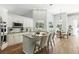 Elegant white kitchen with granite countertops, stainless steel appliances, and breakfast bar seating at 4825 Waterwitch Point Dr, Orlando, FL 32806