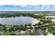 Beautiful aerial view showcasing lakefront homes with lush trees, pristine lake views, and neighborhood layout at 4825 Waterwitch Point Dr, Orlando, FL 32806