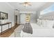 Main bedroom with wood-look floors, bench, and large closet with sliding doors at 4825 Waterwitch Point Dr, Orlando, FL 32806