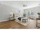 Spacious main bedroom featuring wood-look floors and a seating area at 4825 Waterwitch Point Dr, Orlando, FL 32806