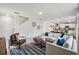 Open-concept living room boasts modern decor and a seamless flow to the adjacent kitchen at 5157 Masser Rd, St Cloud, FL 34772