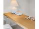 Close-up shot of the desk featuring a wood surface, white lamp and accessories at 5202 Orchard Oriole Loop, Bartow, FL 33830