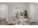 Cozy dining area next to the kitchen, featuring round table, 4 chairs, and modern decor at 5202 Orchard Oriole Loop, Bartow, FL 33830