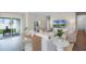 Spacious living room with modern furnishings, light walls, and view of the outdoor patio at 5202 Orchard Oriole Loop, Bartow, FL 33830