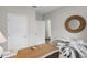 Bright office featuring a wooden desk, decorative mirror, and stylish white driftwood-style accent table at 5202 Orchard Oriole Loop, Bartow, FL 33830
