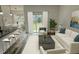 Inviting living room featuring hardwood floors, ample natural light, and a modern open floor plan at 534 S Adelle Ave, Deland, FL 32720