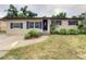 Charming single-story home with blue shutters and a well-maintained front yard at 5615 Arundel Dr, Orlando, FL 32808