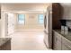 Bright, open kitchen with views into another room and stainless steel appliances visible at 5615 Arundel Dr, Orlando, FL 32808