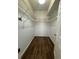 Walk-in closet with wood floors and ample storage space, ideal for organization at 5804 Plum Pudding Ct, Orlando, FL 32821