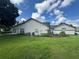 Well-maintained home with lush lawn and landscaping, featuring a lake view and fenced-in patio at 5804 Plum Pudding Ct, Orlando, FL 32821
