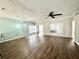 Inviting living room with wood floors, lots of natural light, and a modern ceiling fan at 5804 Plum Pudding Ct, Orlando, FL 32821