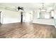 Spacious living room featuring wood floors, neutral walls, and modern ceiling fan at 5804 Plum Pudding Ct, Orlando, FL 32821