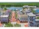 Aerial view highlighting the walkable downtown area featuring shops, dining, and a lake at 660 Celebration Ave # 250, Kissimmee, FL 34747