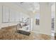 Open kitchen showcasing granite counters, bright white cabinets, and stainless faucet fixture with a ceiling fan at 660 Celebration Ave # 250, Kissimmee, FL 34747