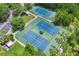Overhead shot of fenced tennis courts, ready for a match, and close to parking at 660 Celebration Ave # 250, Kissimmee, FL 34747