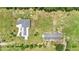 Aerial view of the home showing the private lot and an additional outbuilding on the property at 700 Old Geneva Rd, Geneva, FL 32732