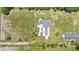 Aerial view of the home showcasing the private lot, manicured landscaping, and outbuilding at 700 Old Geneva Rd, Geneva, FL 32732